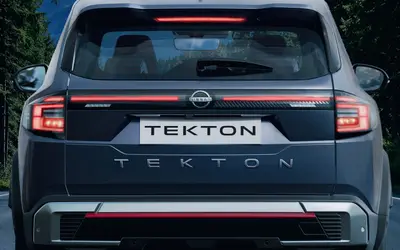 Nissan Tekton rear view with LED light bar on a mountain road