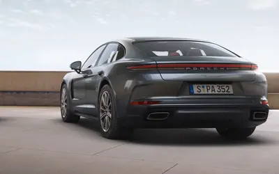 Porsche Panamera rear three-quarter view in dark grey