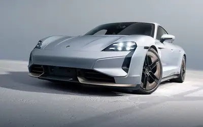 Porsche Taycan Turbo S front three-quarter studio view in white