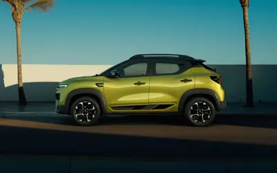 Renault Kiger 2025 facelift side profile in oasis yellow with diamond-cut alloy wheels