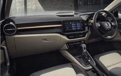Skoda Slavia cabin view of dashboard, steering wheel and dual-tone front seats