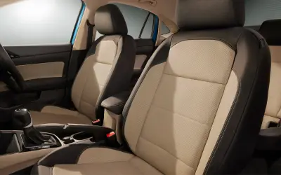 Skoda Slavia beige and black ventilated front seats with centre armrest