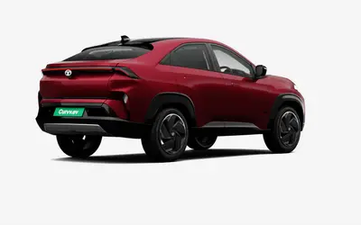 Tata Curvv EV rear three-quarter view from the opposite side in Nitro Crimson