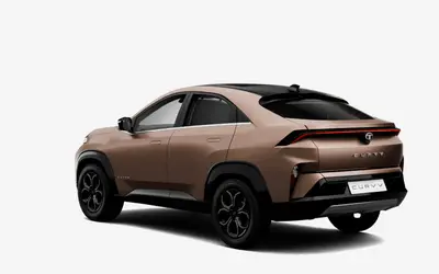 Tata Curvv rear three-quarter view from the opposite side in Gold Essence