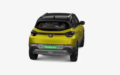 Tata Punch EV rear three-quarter view from the opposite side in Fearless Yellow