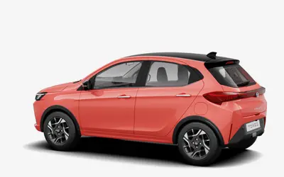 Tata Tiago rear three-quarter view in Vibrance Varanasi orange