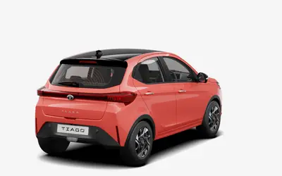 Tata Tiago rear three-quarter view from the opposite side in Vibrance Varanasi orange