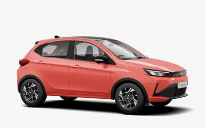 Tata Tiago front three-quarter view from the passenger side in Vibrance Varanasi orange