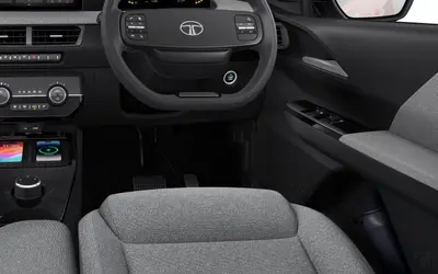 Tata Tiago interior view of the steering wheel, driver seat and door trim