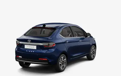 Tata Tigor rear three-quarter view in Arizona Blue
