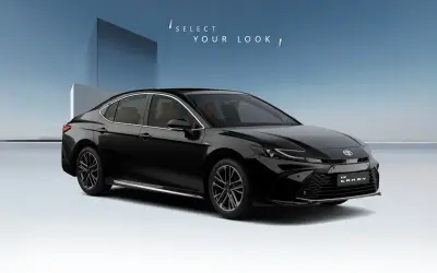 Toyota Camry front three-quarter view in Attitude Black