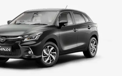 Toyota Glanza front three-quarter view in dark grey