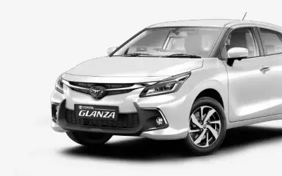 Toyota Glanza front three-quarter view in white