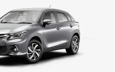 Toyota Glanza front three-quarter view in light grey