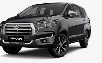 Toyota Innova Crysta front three-quarter view in Attitude Black