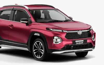 Toyota Urban Cruiser Taisor front three-quarter view in Sportin Red