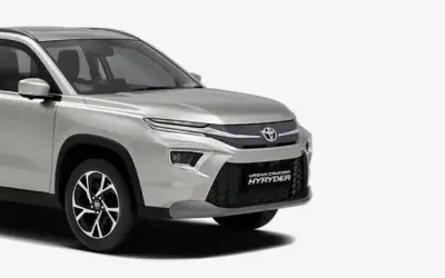 Toyota Urban Cruiser Hyryder front three-quarter view in Cafe White