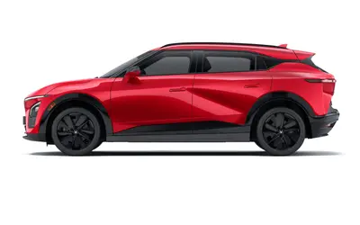 VinFast VF 7 side profile studio render in Solar Ruby