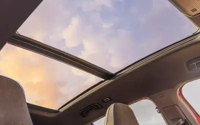 Volkswagen Tiguan R-Line interior - panoramic sunroof seen from the cabin at sunset