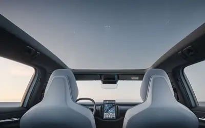 Volvo EX30 front cabin under the panoramic roof, with the central portrait touchscreen